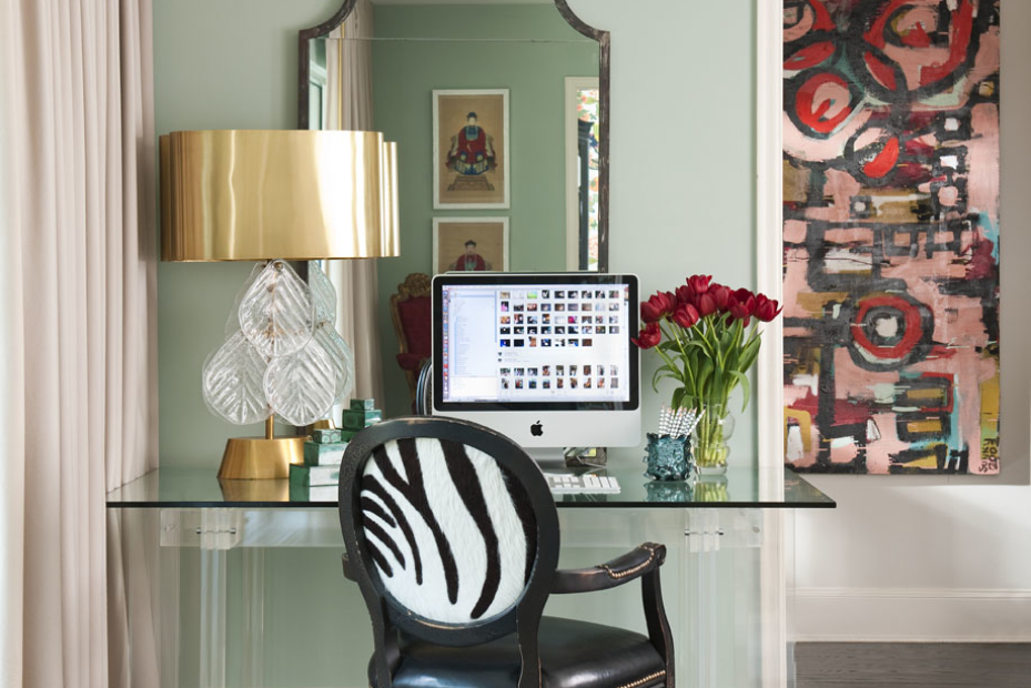 The brass shade of this new Venetian glass lamp helps tie in the gilt antiques that Shelly and Barry inherited. Mixing metals (chrome, brass, gold) energizes a room, says Shelly. A computer in a formal living room instantly turns it into a gathering place, says Shelly, who glammed things up with a Lucite desk and sexy zebra-print French chair.